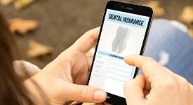 A woman using a dental insurance app