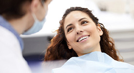 Woman smiling after receiving dental implants in San Antonio, TX