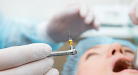 Surgically placing dental implants in San Antonio, TX