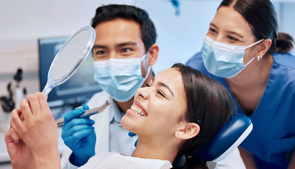 Patient in San Antonio smiling after dental bridge restoration 
