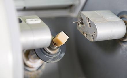 a close-up of a CEREC milling machine