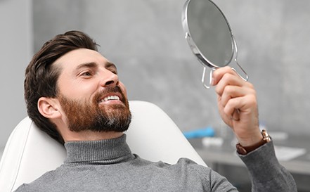 a dental patient smiling proudly