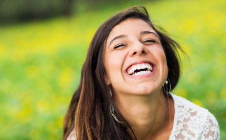 Woman sharing gorgeous smile after gum recontouring