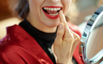 lady is pleased with restored tooth