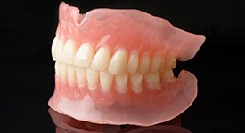 Two partial dentures with metal attachments