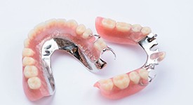 Full set of dentures against dark background