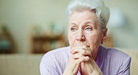 Senior woman with sad expression on her face