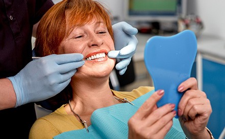 A woman enjoying the benefits of dental implants in San Antonio