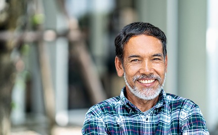 Man smiling with dental implants in San Antonio