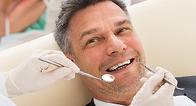 Man smiling at dentist in San Antonio