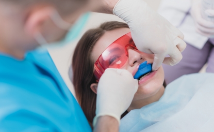 Patient receiving dental treatment after oral cancer screening