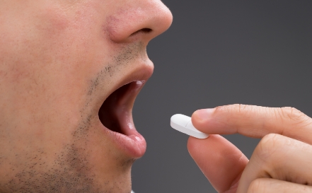 Patient taking oral conscious dental sedation pill