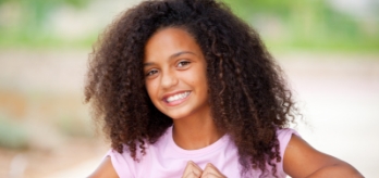 Young dental patient smiling after children's dentistry visit