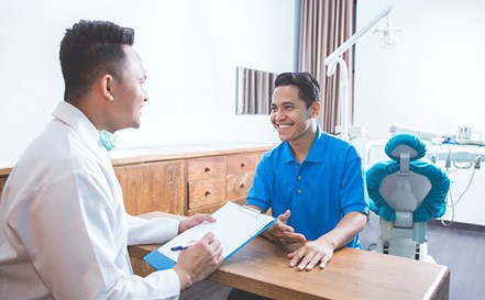 patient talking to dentist about financing options