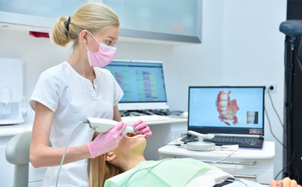 dental assistant using intraoral scanner 