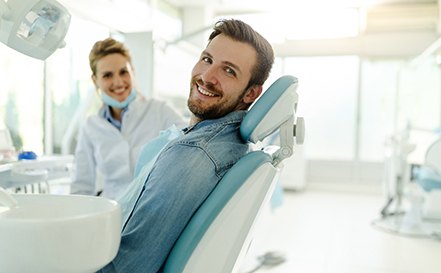 Man smiling while relaxing in treatment chair