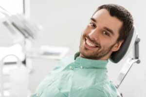 Man smiling after his root canal