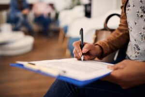 Patient filling out dental insurance paperwork